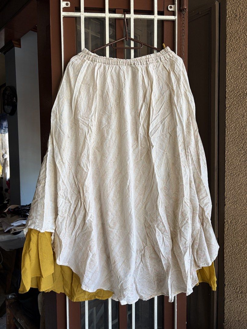 MALAKA Made in India Boho Maxi Skirt with Pockets (Category: Skirts) located in Las Pinas. Submitted by celly_belly (Listing ID 1463177686, Image 1). Description: - Flowy maxi skirt from MALAKA - Cream base with a subtle patterned print - Mustard yellow underskirt for a layered effect - Comfortable elastic waistband - Features convenient pockets - Ideal for casual outings or a beachy aesthetic.