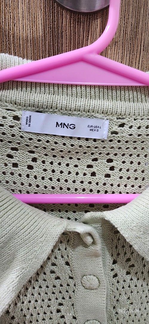 Mango Green Knit Sweater Size G (Category: Coats, Jackets and Outerwear) located in Manila. Submitted by atan2025 (Listing ID 1463225852, Image 2). Description: - Light green knit sweater from Mango - Features a textured pattern with stylish cutouts - Classic collar with button details at the neckline - Size G (MEX) - Made in China.