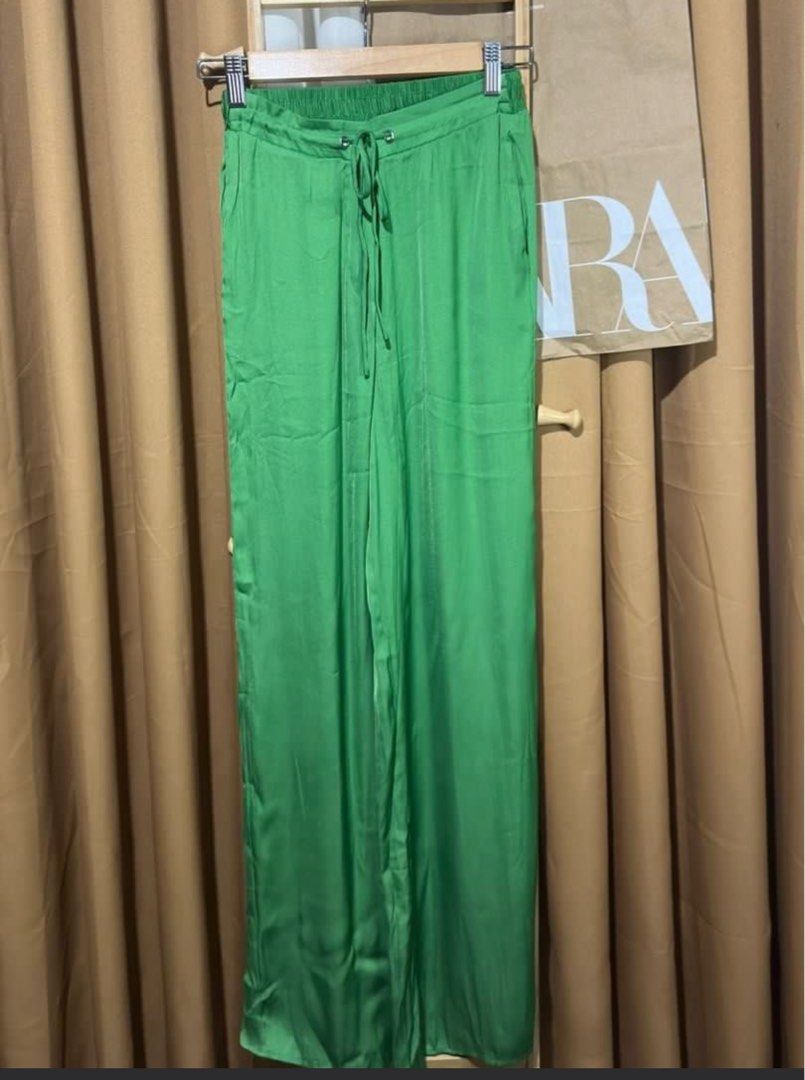 Mango Green Wide Leg Satin Pants (Category: Other Bottoms) located in Paranaque City. Submitted by arolabs (Listing ID 1463150379, Image 2). Description: - Brand: Mango - Material: Satin - Color: Green - Style: Wide leg pants - Features: Elastic waistband with drawstring - Comfort: Super comfy and chic - Versatility: Great for dressing up or down, pair with a cute top for a complete outfit..