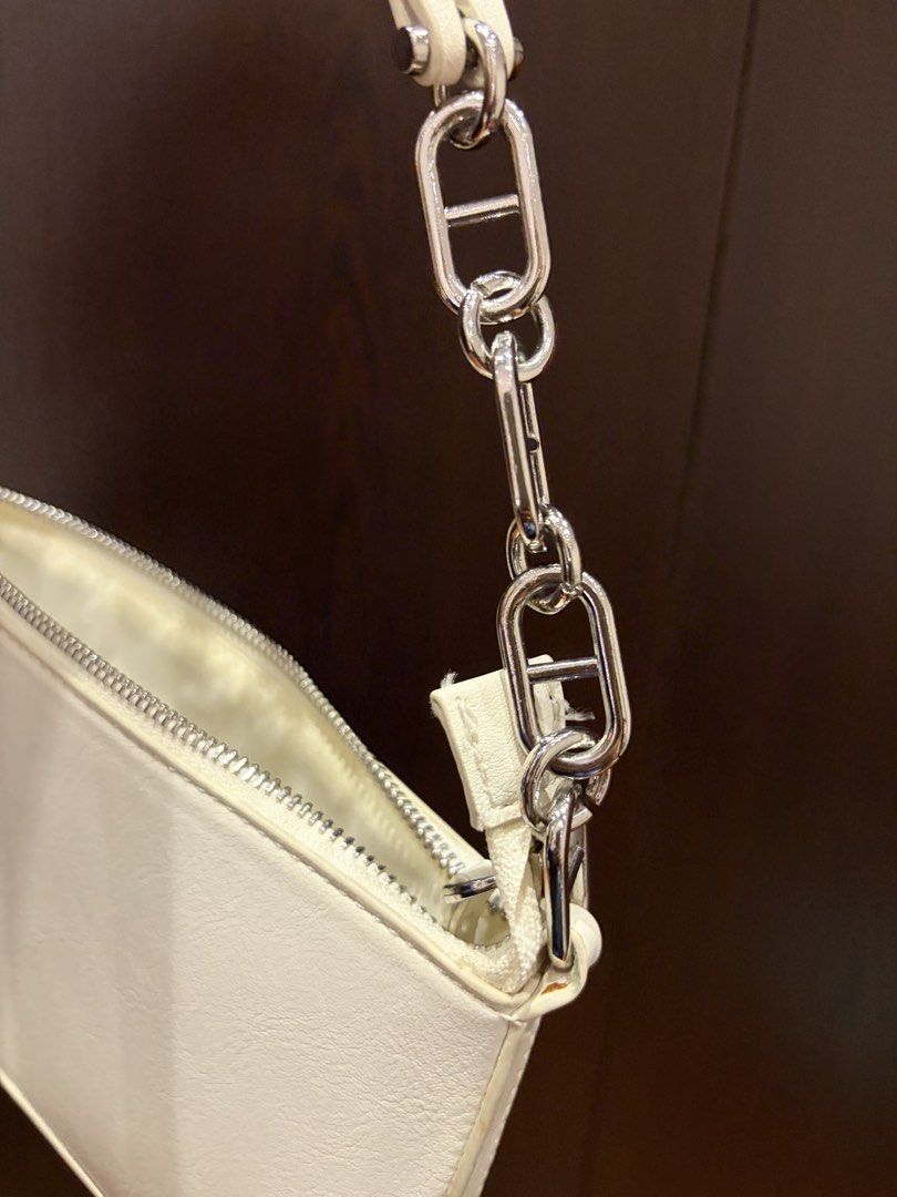 MANGO MANDY White Small Shoulder Bag with Chain Strap (Category: Shoulder Bags) located in Quezon City. Submitted by vwj.g (Listing ID 1463254250, Image 2). Description: ⭐️ RFS: Decluttering ⭐️ Details: - Brand: MANGO (MNG) - Model: Mandy Shoulder Bag - Never used - Minor paint/coating wear on the top handle due to storage - Bag body and hardware are otherwise in good condition - Silver chain strap with unique links - Zipper closure - Interior MN