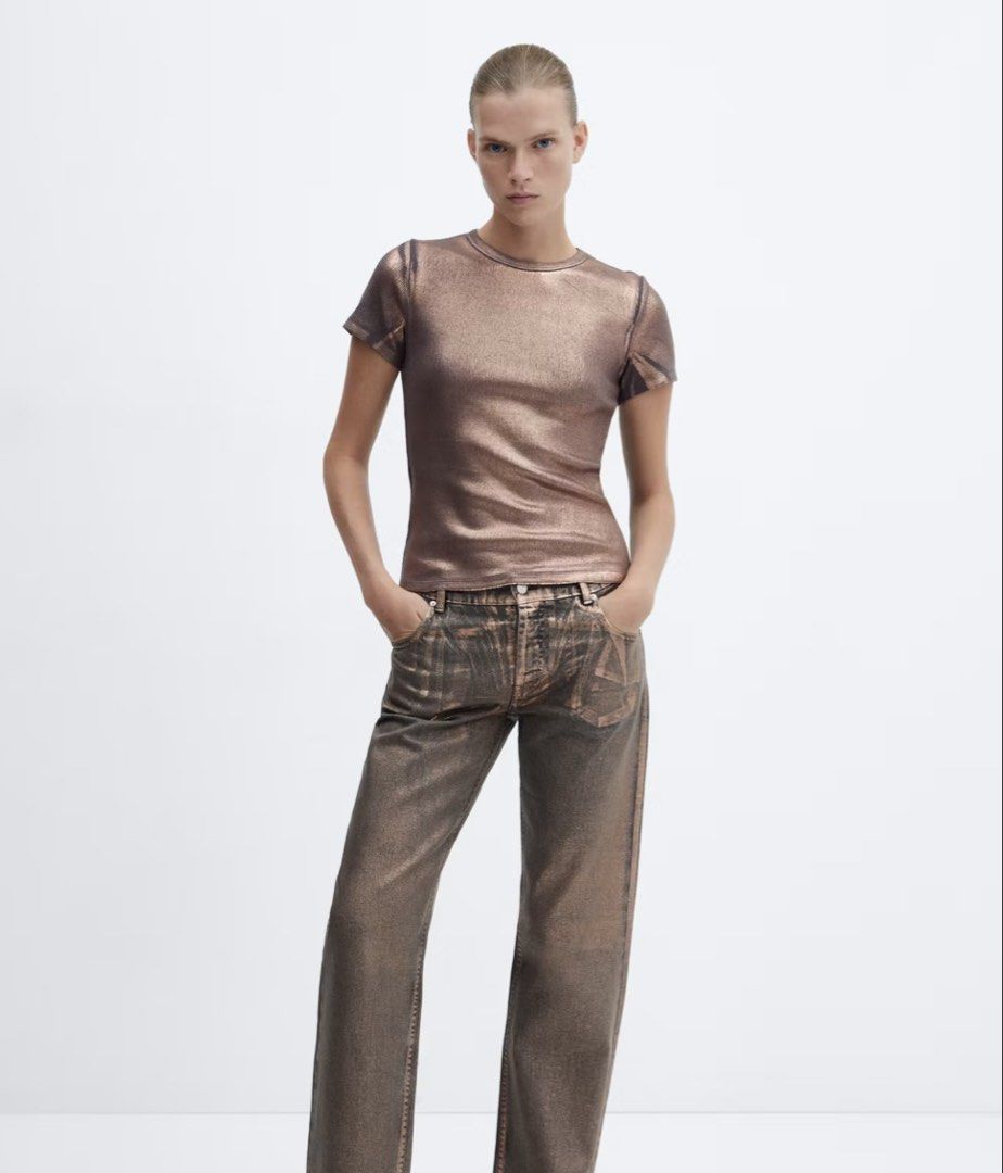 MANGO Metallic Ribbed Short Sleeve T-shirt (Category: Shirts) located in Cagayan de Oro. Submitted by jeirn (Listing ID 1463121876, Image 2). Description: - Bronze metallic ribbed t-shirt - Short sleeves, crew neck - Very stretchy material - Versatile: dress up or down - Pairs well with jeans or skirts - Adds a nice shimmer to any outfit.