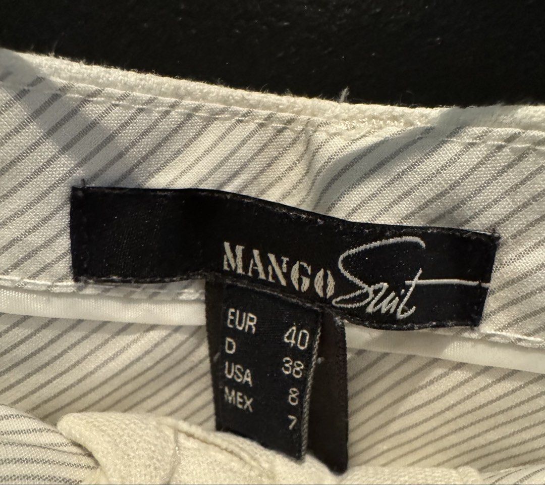 Mango Suit White Linen Blend Cropped Pants (Category: Other Bottoms) located in Mandaluyong City. Submitted by marshy (Listing ID 1463250704, Image 3). Description: Slight discoloration on folds (washable).