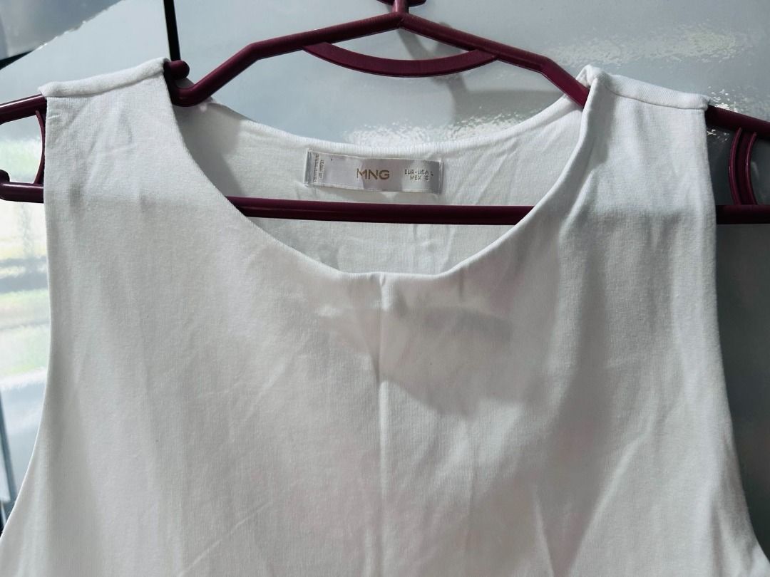 MANGO White Sleeveless Top (Category: Sleeveless) located in Pasig City. Submitted by ladyleslieisletavelarde4902 (Listing ID 1463229188, Image 2). Description: Simple, clean, and effortlessly classy! Perfect for everyday wear or for a smart-casual look. ✨ Brand: Mango Size: S to M Excellent preloved condition MOP: Gcash / Bank Transfer Purchase direct from store Delivery: SF shouldered by buyer .