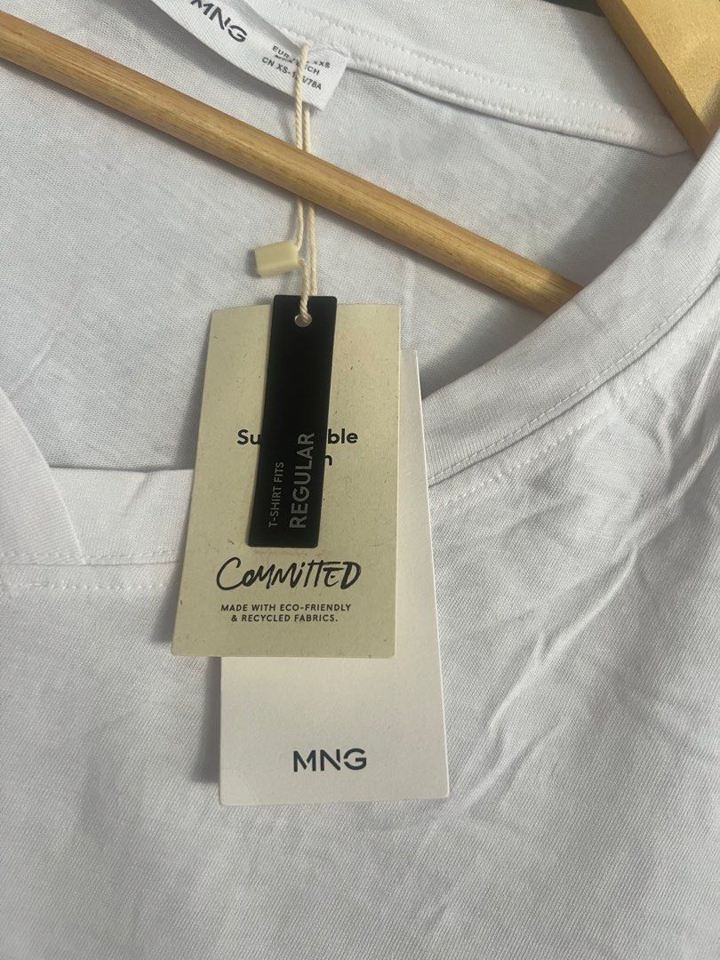 MANGO White V-Neck T-Shirt - Committed Collection (Category: Shirts) located in Cagayan de Oro. Submitted by jeirn (Listing ID 1463124414, Image 2). Description: - MNG white V-neck t-shirt - Part of the Committed collection (eco-friendly & recycled fabrics) - Regular fit with short sleeves - Versatile and essential for everyday wear.