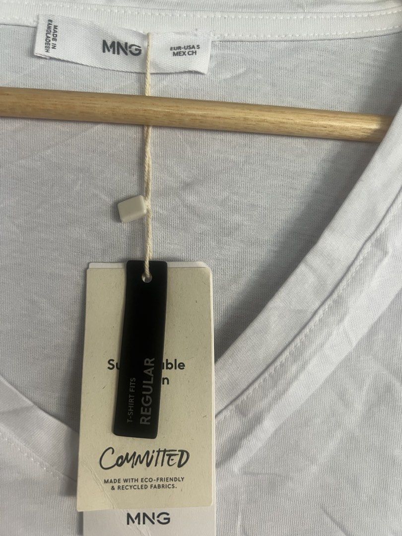 Mango White V-Neck T-Shirt Committed Collection Size S (Category: Shirts) located in Cagayan de Oro. Submitted by jeirn (Listing ID 1463124480, Image 2). Description: - MNG White V-neck T-shirt - Size: S - Part of the 'Committed' collection (eco-friendly & recycled fabrics) - Regular fit - Ideal for everyday wear.