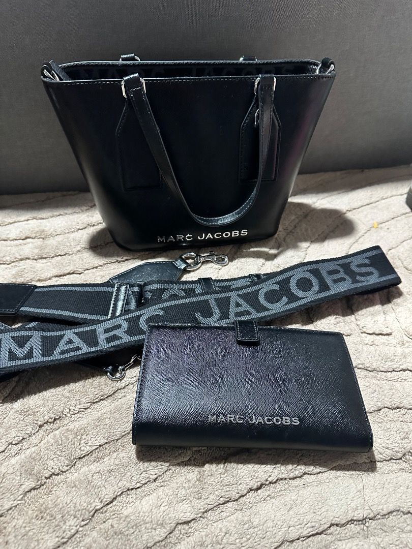 Marc Jacobs Black Hand Bag with Strap and Wallet (Category: Luxury Bags & Wallets) located in Calamba. Submitted by daisy214 (Listing ID 1463291323, Image 1). Description: - Authentic Black Marc Jacobs Hand Bag (bought for 15k pesos) - Comes with a detachable shoulder strap - Includes a matching WALLET (bought for 7k pesos) - Interior zip pocket for secure storage - Iconic Marc Jacobs logo detail - Ideal size for everyday essentials - Clean and w