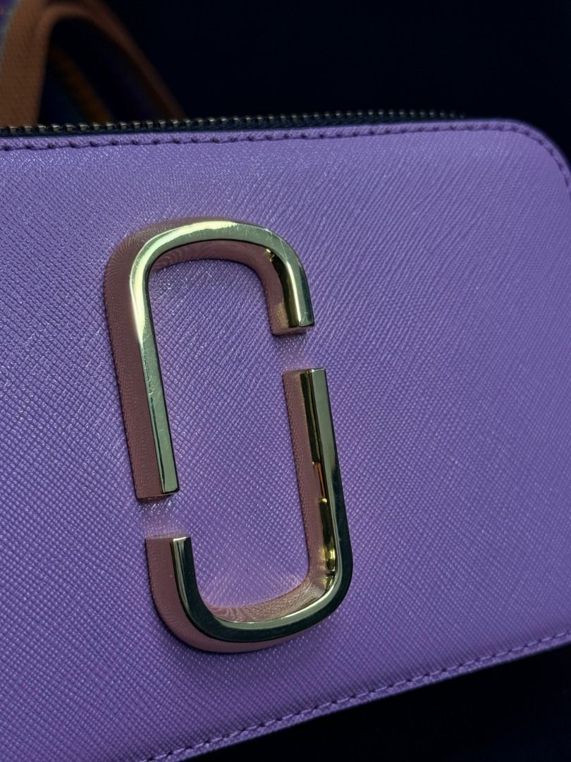 Marc Jacobs Snapshot Camera Bag Purple Gold Hardware (Category: Luxury Bags & Wallets) located in Caloocan City. Submitted by grandbear.ee4db0 (Listing ID 1463206629, Image 3). Description: MARC JACOBS THE SNAPSHOT ₱15,000 | Negotiable | Open for offers Specifications: • Model: The Snapshot • Color: Regal Orchid Multi • Style Code: H172L01SP22-518 • Material: Saffiano Leather • Size: 18 × 6 × 11 cm • Details: Double-Zip Compartments, Signature J 