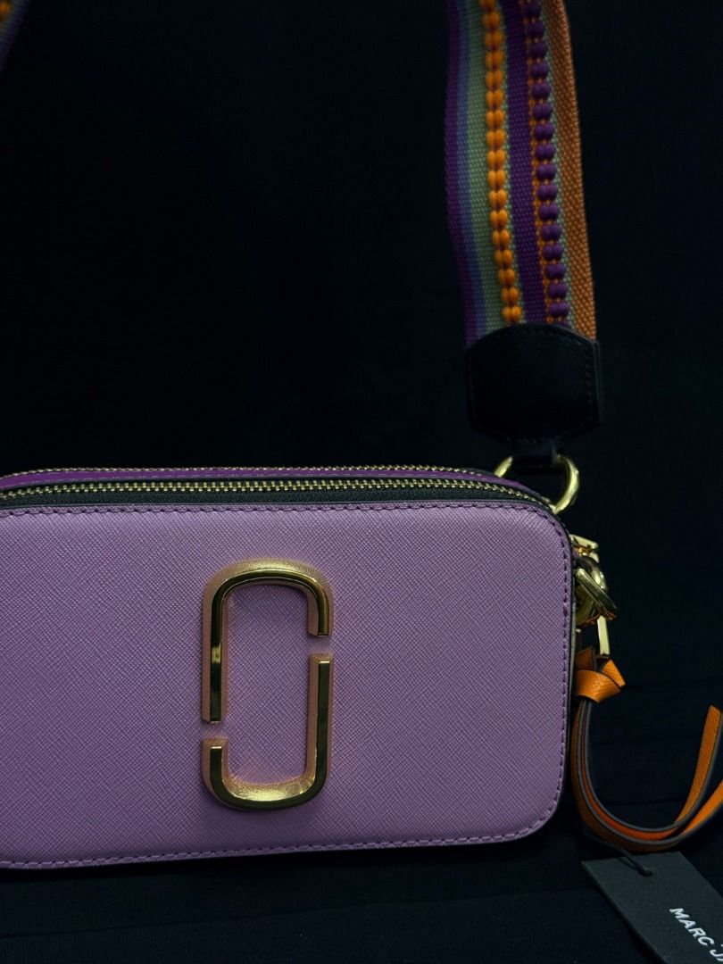 Marc Jacobs Snapshot Camera Bag Purple Gold Hardware (Category: Luxury Bags & Wallets) located in Caloocan City. Submitted by grandbear.ee4db0 (Listing ID 1463206629, Image 1). Description: MARC JACOBS THE SNAPSHOT ₱15,000 | Negotiable | Open for offers Specifications: • Model: The Snapshot • Color: Regal Orchid Multi • Style Code: H172L01SP22-518 • Material: Saffiano Leather • Size: 18 × 6 × 11 cm • Details: Double-Zip Compartments, Signature J 