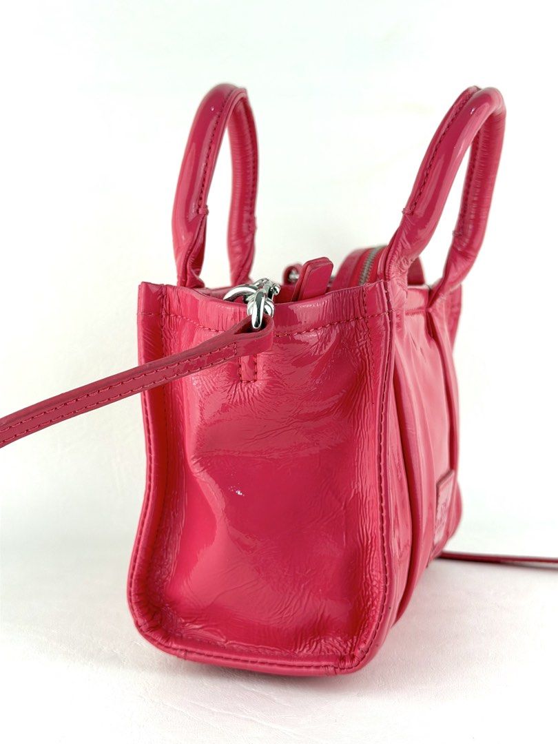 MARC JACOBS The Shiny Crinkled Mini Tote Bag (Category: Cross-body Bags) located in Manila. Submitted by luvluxe.mnl (Listing ID 1463151539, Image 3). Description: Small size- but can fit a lot of small stuffs Soooo pretty!! 😍🩷 as in lalo in person In barbie pink color In excellent condition Rare sizeee Must have!! Worth having!! .