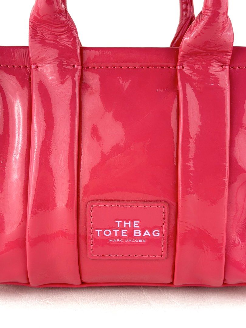 MARC JACOBS The Shiny Crinkled Mini Tote Bag (Category: Cross-body Bags) located in Manila. Submitted by luvluxe.mnl (Listing ID 1463151539, Image 2). Description: Small size- but can fit a lot of small stuffs Soooo pretty!! 😍🩷 as in lalo in person In barbie pink color In excellent condition Rare sizeee Must have!! Worth having!! .