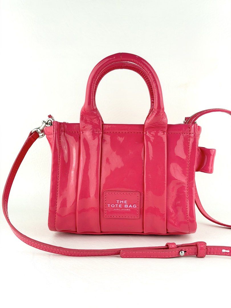 MARC JACOBS The Shiny Crinkled Mini Tote Bag (Category: Cross-body Bags) located in Manila. Submitted by luvluxe.mnl (Listing ID 1463151539, Image 1). Description: Small size- but can fit a lot of small stuffs Soooo pretty!! 😍🩷 as in lalo in person In barbie pink color In excellent condition Rare sizeee Must have!! Worth having!! .