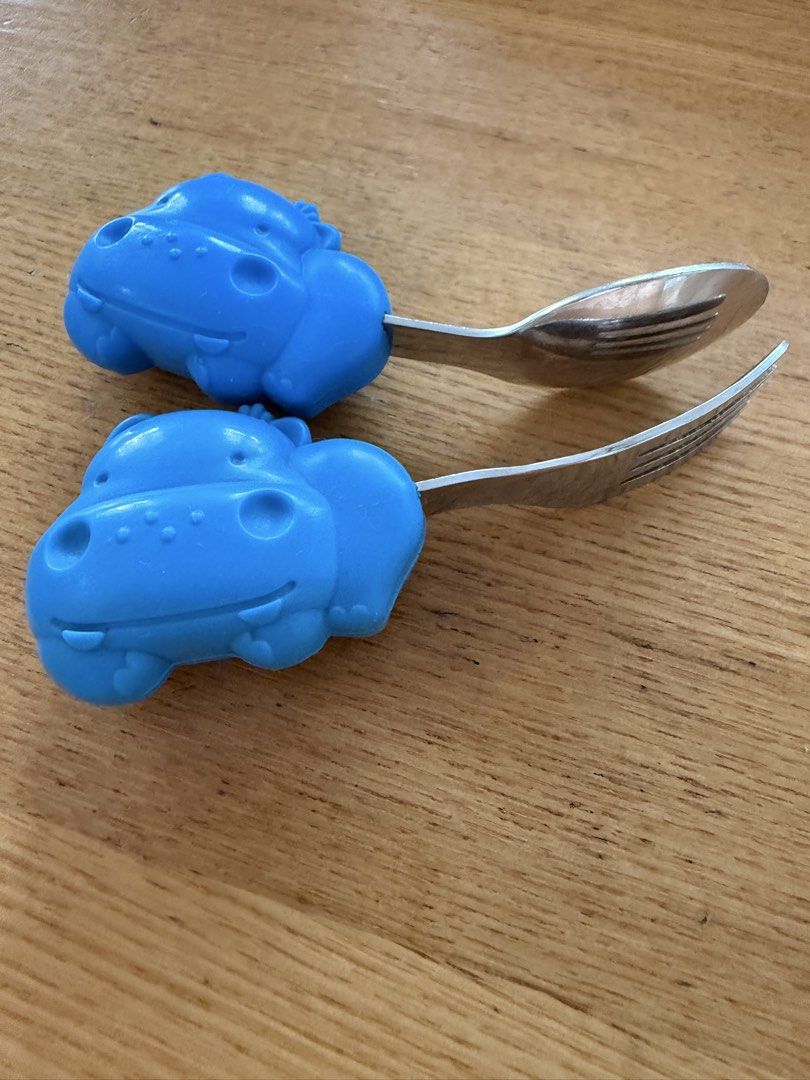 Marcus and Marcus Blue Hippo Baby Fork and Spoon Set (Category: Weaning & Toddler Feeding) located in Quezon City. Submitted by zelev (Listing ID 1463168826, Image 3). Description: - Marcus and Marcus -Cute blue hippo shaped handles - Ideal for little hands learning to self-feed - Standard size metal parts - Minor scuffs on metal from normal use - Perfect for toddlers starting solids Lightly used.