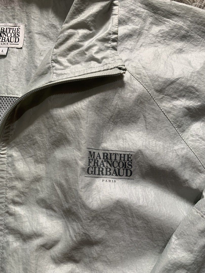 MARITHE FRANCOIS GIRBAUD Light Grey Zip Up Jacket Size L (Category: Coats, Jackets and Outerwear) located in Cebu City. Submitted by ninyothrift (Listing ID 1463183885, Image 3). Description: - Light grey Marithe Francois Girbaud jacket - Size L - Zip-up front with collar - Elasticated cuffs and hem - Two side pockets - Mesh lining inside - Ideal for layering or light outerwear - Dimes: 25x28 - As new condition - issue stain not sure if washable.