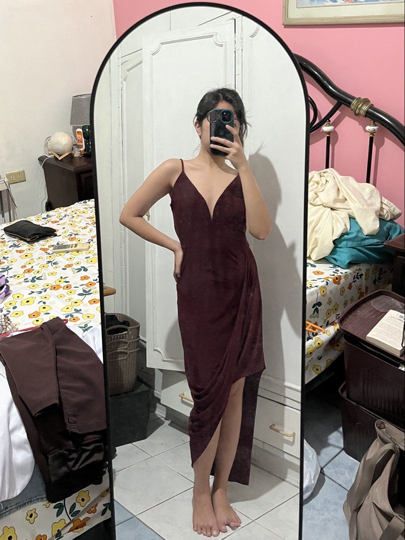 Maroon Asymmetrical Spaghetti Strap Dress (Category: Dresses) located in Mabalacat. Submitted by byjenica (Listing ID 1463237024, Image 1). Description: - Used twice lang - Elegant maroon dress - Deep V-neckline with delicate spaghetti straps - Flattering asymmetrical hemline - Chic side ruching detail - Subtle textured fabric for added sophistication - Ideal for parties, weddings, and formal occasions - Designed for a great fit and beautiful dra