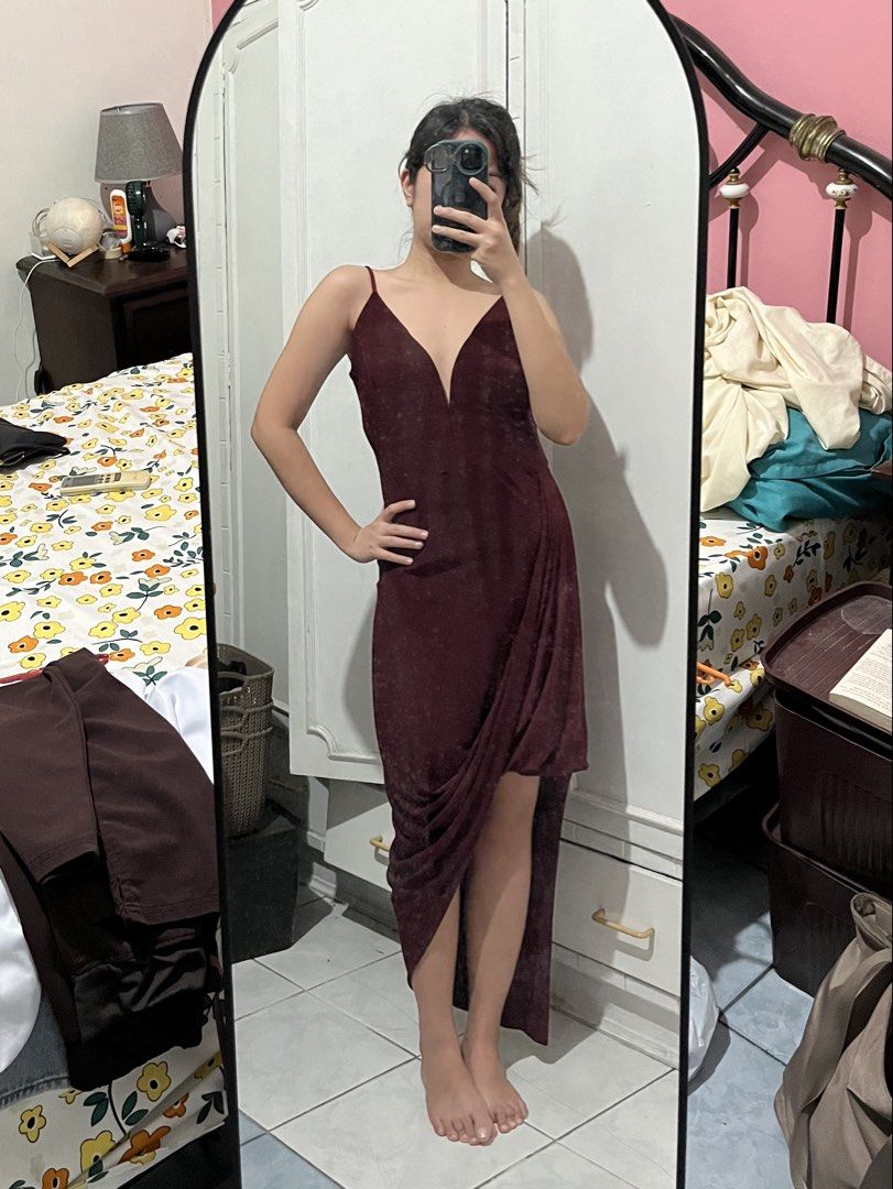 Maroon Asymmetrical Spaghetti Strap Dress (Category: Dresses) located in Mabalacat. Submitted by byjenica (Listing ID 1463237024, Image 2). Description: - Used twice lang - Elegant maroon dress - Deep V-neckline with delicate spaghetti straps - Flattering asymmetrical hemline - Chic side ruching detail - Subtle textured fabric for added sophistication - Ideal for parties, weddings, and formal occasions - Designed for a great fit and beautiful dra