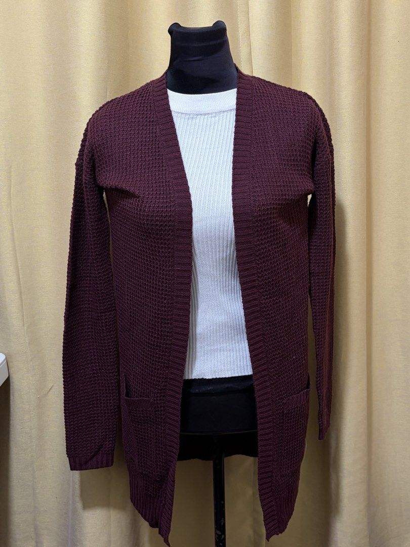 Maroon Waffle Knit Long Cardigan with Pockets (Category: Coats, Jackets and Outerwear) located in Baguio. Submitted by fionabanana (Listing ID 1463254755, Image 1). Description: - Cozy maroon cardigan - Waffle knit texture - Long sleeves - Two front pockets - Ideal for layering over tops - Perfect for casual outings Never been used.