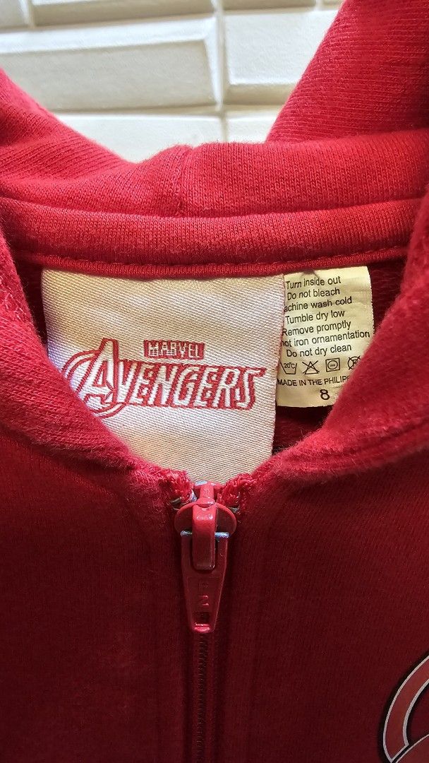 Marvel Avengers Red Zip-Up Hoodie (Category: Hoodies) located in Quezon City. Submitted by dawnest (Listing ID 1463277839, Image 3). Description: - Red zip-up hoodie featuring the Avengers! - Awesome graphics on the back: Iron Man, Captain America, Thor, and Hulk. - Avengers logo proudly displayed on the front. - Proudly made in the Philippines. - Please note: there is a small dark washable mark , clearly shown in the last photo..
