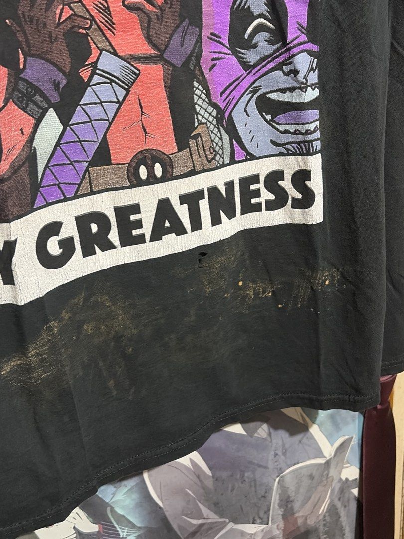 [MARVEL TEE] Marvel Deadpool "Surrounded by Greatness" T-Shirt (Category: Tshirts & Polo Shirts ) located in Imus. Submitted by frootiloots4103 (Listing ID 1463170320, Image 3). Description: - Marvel t-shirt featuring Deadpool and friends - Graphic: "Surrounded by Greatness" - Size: 24x28 inches - Issue: Bleach Stain and Fingerhole - Condition: Small hole and marks on the front bottom (please check photos for details) - Ideal for any Marvel fan.