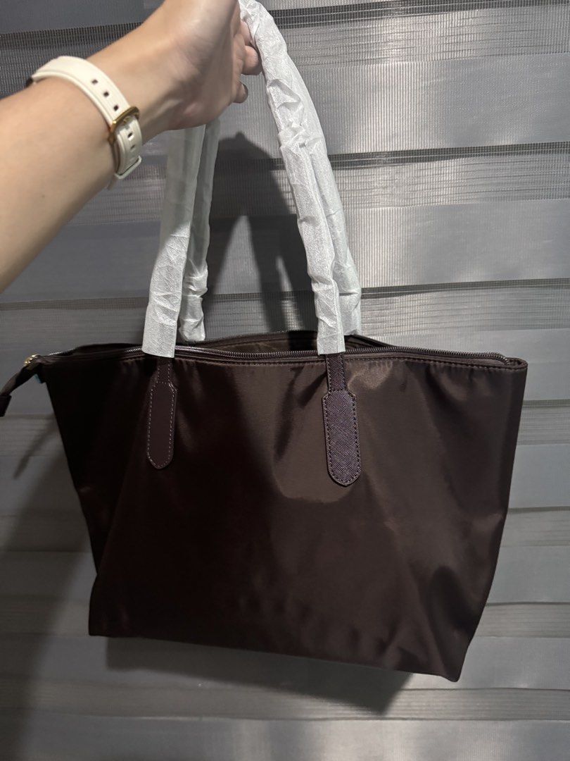 Matthews Tote Bag - Brown Nylon (Category: Tote Bags) located in Taguig. Submitted by grayanna (Listing ID 1463248548, Image 3). Description: - Brand: Matthews - Color: Brown - Material: Nylon - Features: Zippered main compartment, interior zip pocket - Condition: Handles still wrapped in plastic, includes original tag - Ideal for: Everyday use.