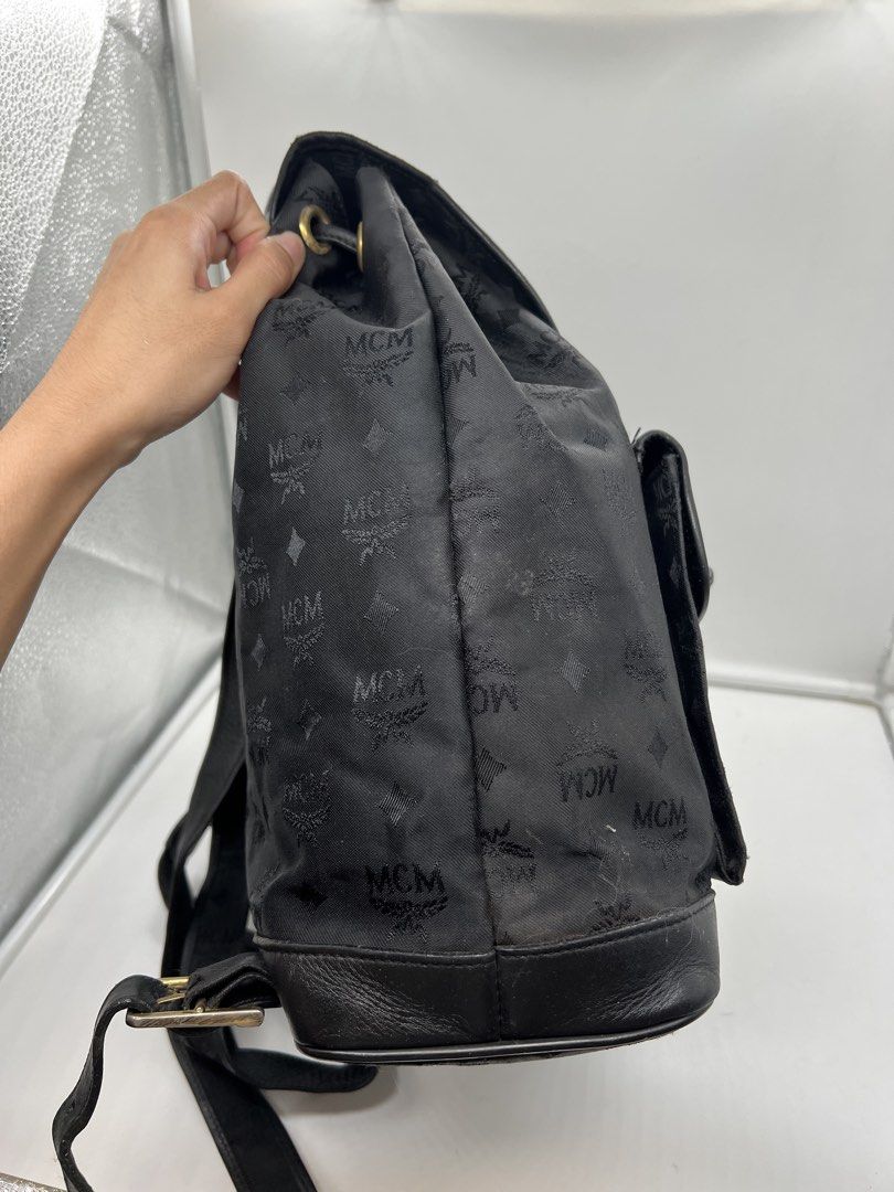 MCM black monogram nylon leather drawstring backpack (Category: Backpacks) located in Cavite. Submitted by aellavier (Listing ID 1463146299, Image 3). Description: orig preloved vintage auth. has signs of use, needs cleaning. MCM germany vintage .