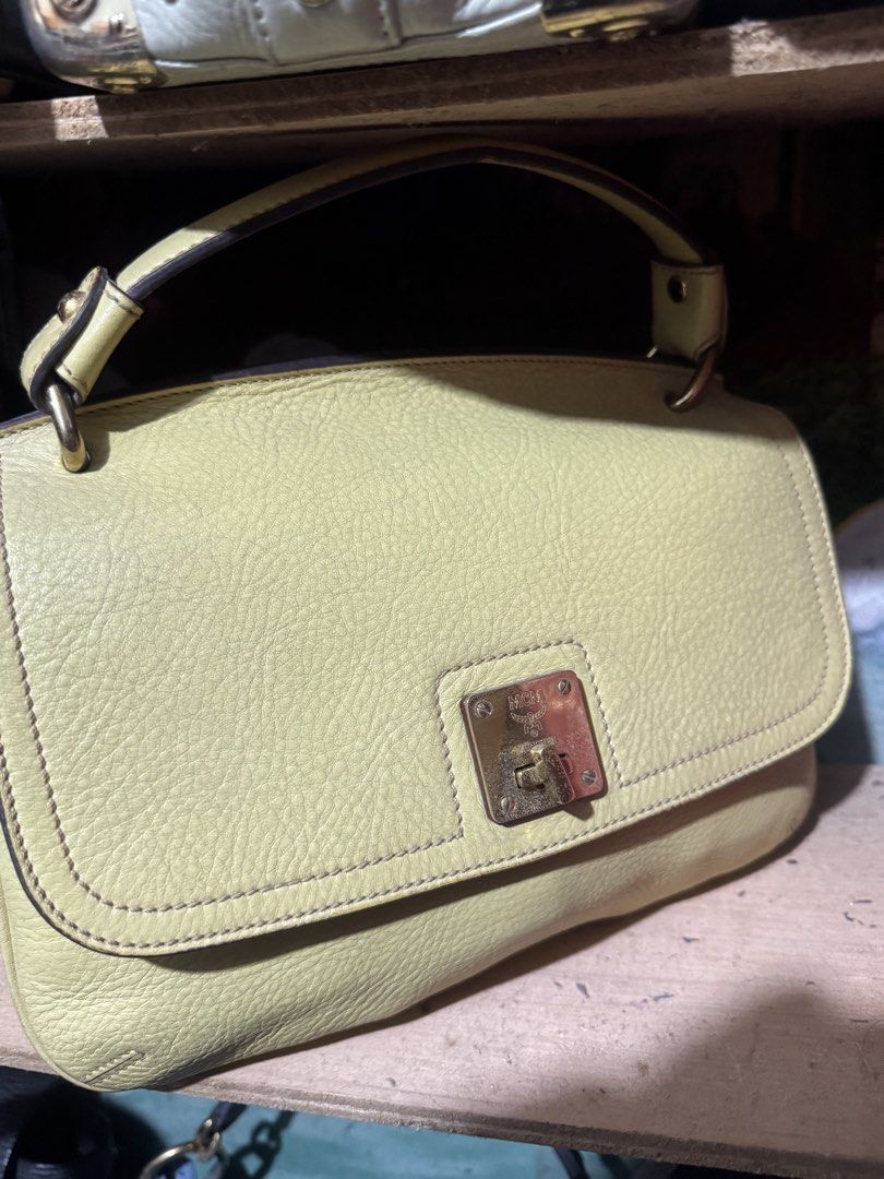 MCM top handle (Category: Luxury Bags & Wallets) located in Quezon City. Submitted by angel12171984 (Listing ID 1463287570, Image 1). Description: Brand : MCM Color : Yellow Gold Hardwear (some faded harwear) Rank : 8/10 Medium size AUTHENTIC .