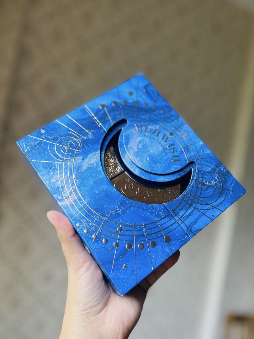 MEH WISH Moon Perfume Bottle (Category: Fragrance & Deodorants) located in Bacolod City. Submitted by vintage_vogue6100 (Listing ID 1463210360, Image 2). Description: - Unique MEH WISH perfume bottle in a crescent moon shape. - Features celestial-themed packaging with elegant gold accents on a deep blue background. - Intricately detailed bottle design. - An eye-catching piece, ideal for collectors. - Makes a wonderful gift..