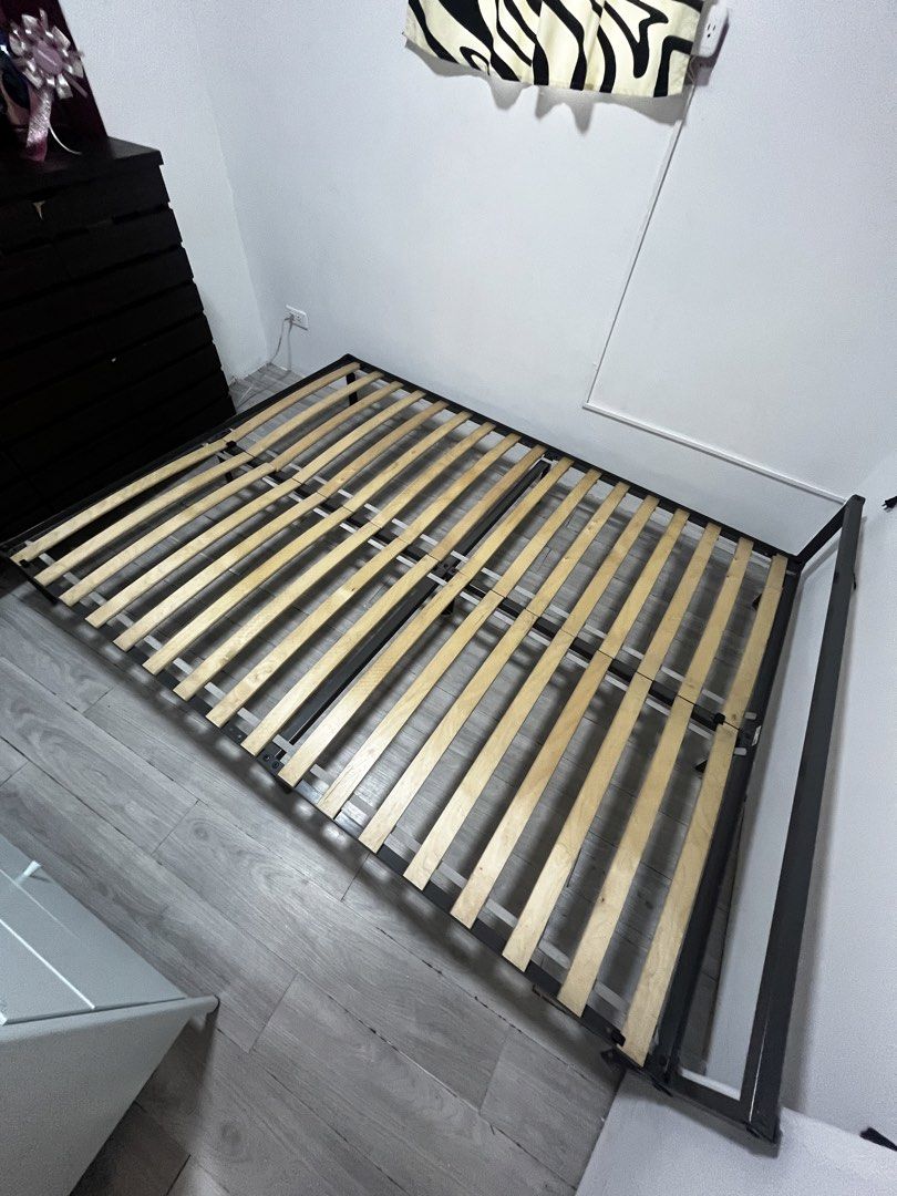 Metal Bed Frame with Wooden Slats (Category: Bed Frames & Mattresses) located in Cavite. Submitted by kulota.store (Listing ID 1463124768, Image 3). Description: - Sturdy metal bed frame - Wooden slats for good mattress support - Easy to assemble - Ideal for bedroom upgrades - Mattress not included - Selling as is.