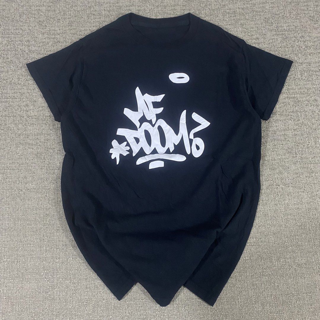 MF Doom Rap Official Merch Tshirt (Category: Tshirts & Polo Shirts ) located in Los Banos. Submitted by adothrift (Listing ID 1463223392, Image 3). Description: MF Doom Rap Official Merch Tshirt Size: S-M Dimensions: Width - 17.5 Length - 26.