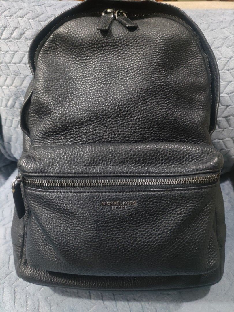 Michael Kors Black Leather Backpack (Category: Backpacks) located in Cainta. Submitted by luxesparkle (Listing ID 1463269668, Image 2). Description: - Authentic Michael Kors black leather backpack - Features a pebbled leather texture - Main zippered compartment for secure storage - Additional front zippered pocket for quick access - Adjustable shoulder straps for a comfortable fit - Interior is clean and well-maintained - Ideal for everyday use, 