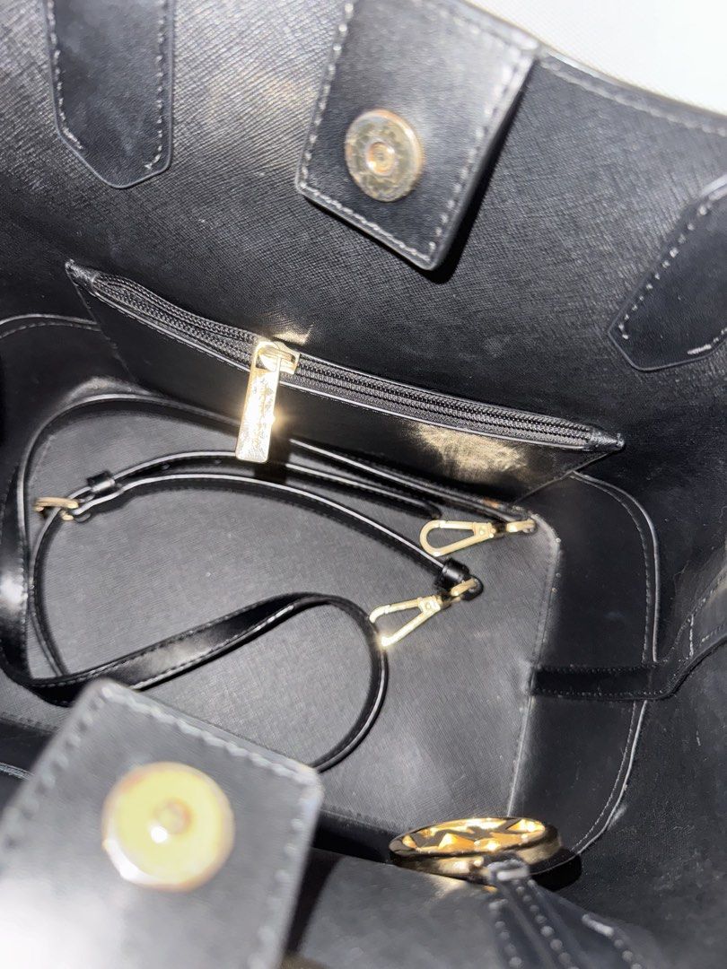 Michael Kors Black Leather Tote Bag (Category: Luxury Bags & Wallets) located in Taguig. Submitted by findfendifirst (Listing ID 1463240165, Image 3). Description: Guaranteed authentic. Very nice and spacious. Comes with shoulder strap RFS decluttering - Classic black Michael Kors tote bag - Genuine saffiano leather exterior with smooth leather trim - Elegant gold hardware details - Interior zip pocket for secure storage - Includes a convenient c