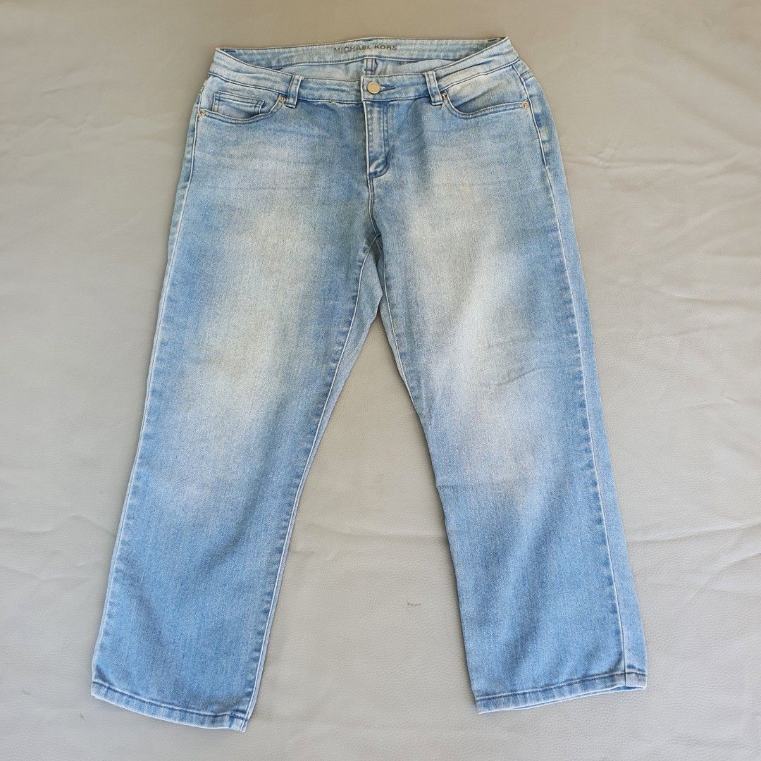 Michael Kors Light Wash Denim Jeans (Category: Jeans) located in Laoag. Submitted by soukay (Listing ID 1463127954, Image 1). Description: - Brand: Michael Kors - Style: Light wash denim jeans - Features: Classic five-pocket style, button and zip closure - Detail: Subtle distressing for a worn-in look - Occasion: Great for casual wear.