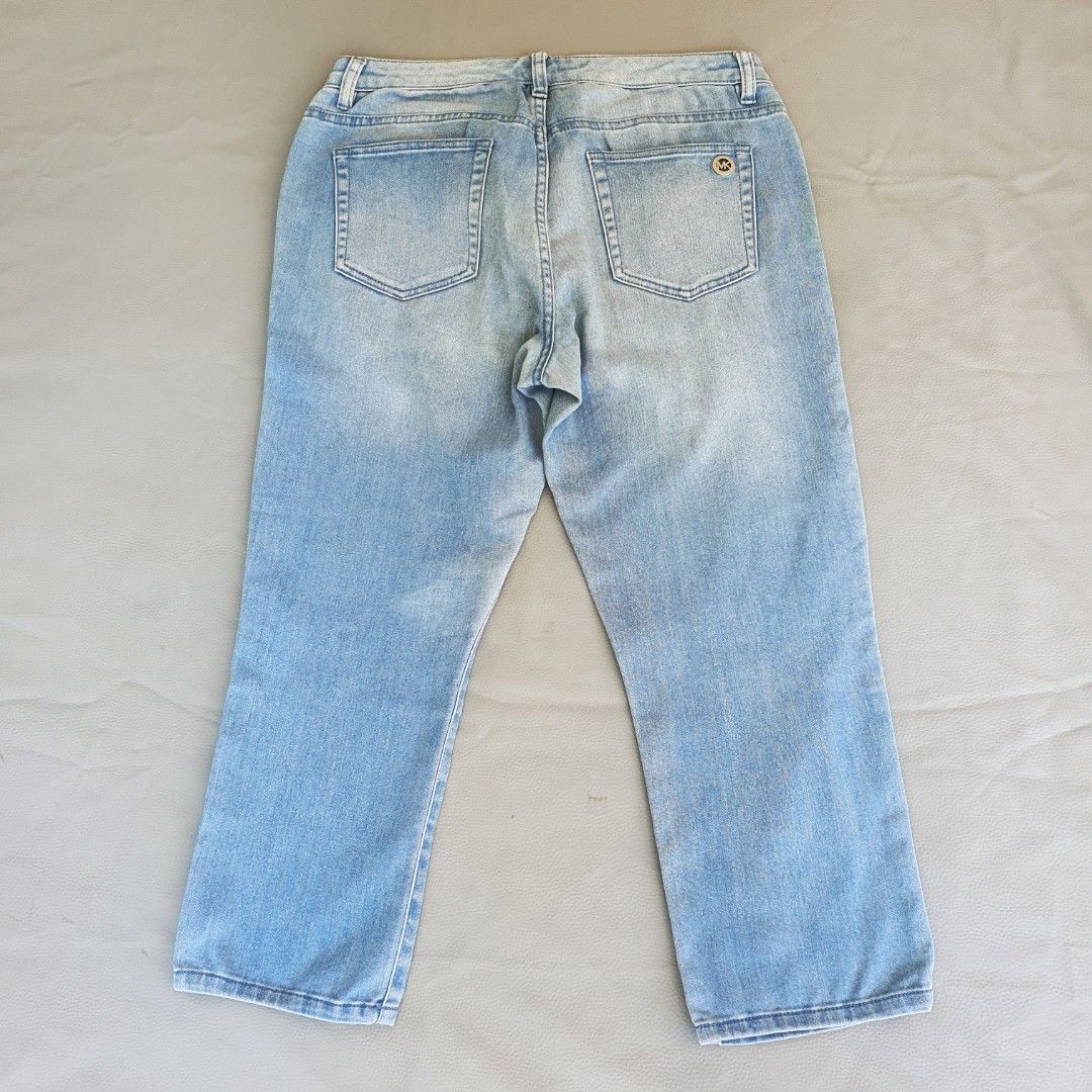 Michael Kors Light Wash Denim Jeans (Category: Jeans) located in Laoag. Submitted by soukay (Listing ID 1463127954, Image 2). Description: - Brand: Michael Kors - Style: Light wash denim jeans - Features: Classic five-pocket style, button and zip closure - Detail: Subtle distressing for a worn-in look - Occasion: Great for casual wear.