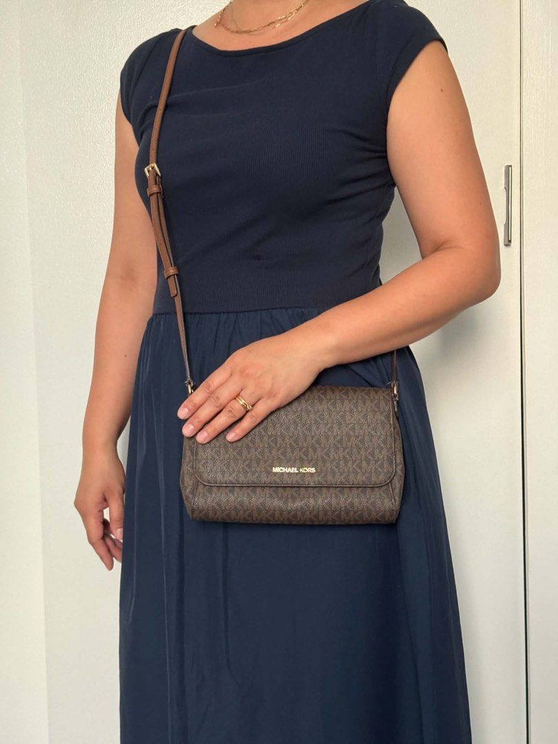 Michael Kors Monogram Crossbody Bag Brown (Category: Luxury Bags & Wallets) located in Taguig. Submitted by kittychum (Listing ID 1463270701, Image 2). Description: 💯Authentic Condition: 7/10 With minimal signs of usage No inclusion .