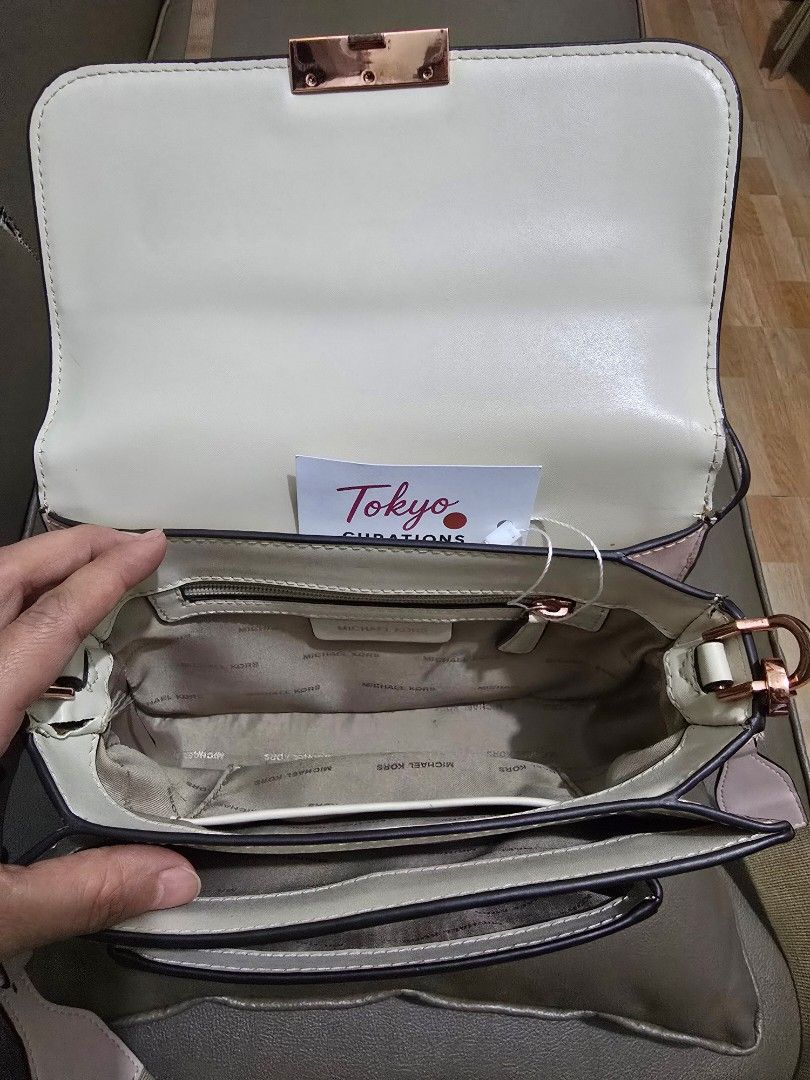 Michael Kors Pink Shoulder / Body Bag (Category: Luxury Bags & Wallets) located in Marikina City. Submitted by bloomsandgreenscollection (Listing ID 1463284272, Image 2). Description: - Michael Kors shoulder bag with adjustable guitar strap - Color: Pink and cream - Bright Rose gold hardware - Minor issue in the last pic - Bought from Tokyo Curations Live Selling - Japan pre-loved bag - RFS: need bigger bags.