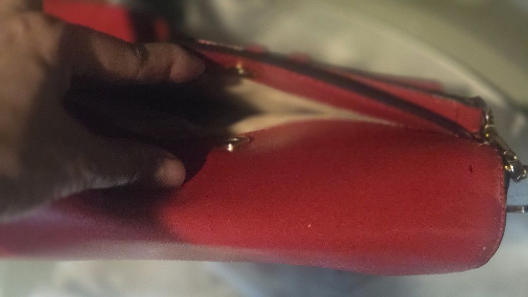 Michael Kors Red Leather Shoulder Bag (Category: Luxury Bags & Wallets) located in Paranaque City. Submitted by itsmemichel (Listing ID 1463279007, Image 3). Description: - Authentic Michael Kors red leather shoulder bag - Elegant gold hardware details - Features a spacious main compartment - Convenient front pocket for quick access - Adjustable strap for comfortable wear - Versatile for everyday use or evening outings - Interior and exterior are