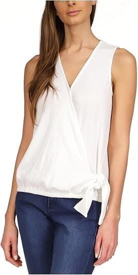 MICHAEL MICHAEL KORS Womens White (Category: Sleeveless) located in Manila. Submitted by april_sixteen (Listing ID 1463201831, Image 1). Description: - Sleeveless wrap top in white - Flattering V-neckline - Adjustable side tie detail - Subtle textured stripe fabric - Versatile: pairs well with jeans or skirts - Ideal for casual outings or evening events.