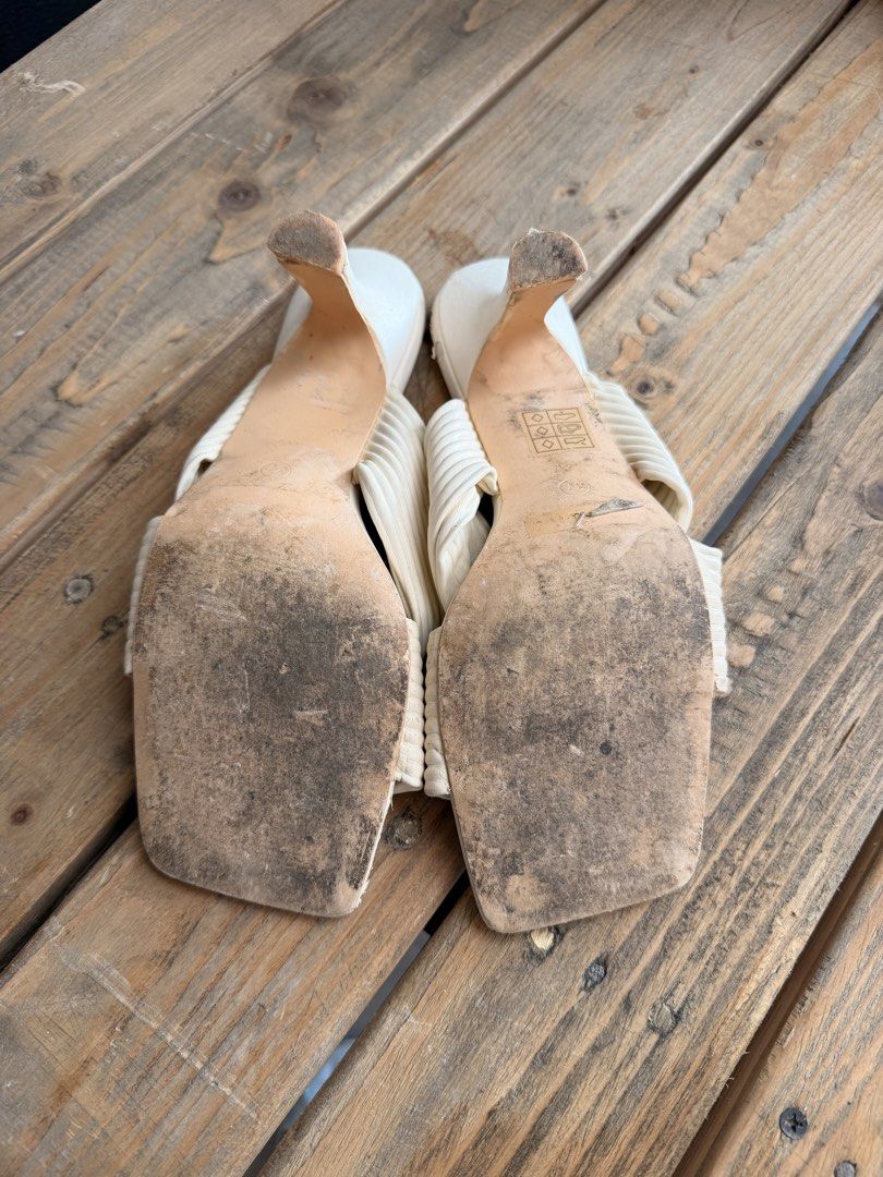 MILLOT & CO. Cream Ribbed Square Toe Mules Heels (Category: Heels) located in Tuguegarao City. Submitted by joysmithznjo (Listing ID 1463201991, Image 3). Description: - Brand: MILLOT & CO. - Color: Cream - Style: Mules - Features: Ribbed strap across foot, square toe, block heel - Condition: Shows some scuffs on the toe and dirty soles. Please check photos for detailed condition..
