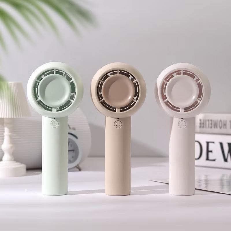 Mini Handheld Portable Fan with Lanyard (Category: Fans) located in Manila. Submitted by iliasjen3082126 (Listing ID 1463216536, Image 2). Description: - Cute and portable fan for on-the-go cooling. - Available in stylish pastel green, beige, and cream colors. - Includes a lanyard for convenient carrying. - Compact size easily fits in your bag. - Simple one-button operation. - Ideal for hot weather or stuffy indoor spaces..