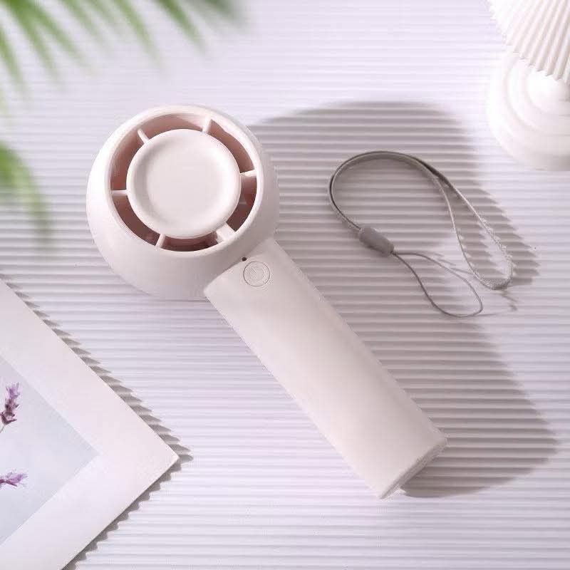 Mini Handheld Portable Fan with Lanyard (Category: Fans) located in Manila. Submitted by iliasjen3082126 (Listing ID 1463216536, Image 3). Description: - Cute and portable fan for on-the-go cooling. - Available in stylish pastel green, beige, and cream colors. - Includes a lanyard for convenient carrying. - Compact size easily fits in your bag. - Simple one-button operation. - Ideal for hot weather or stuffy indoor spaces..