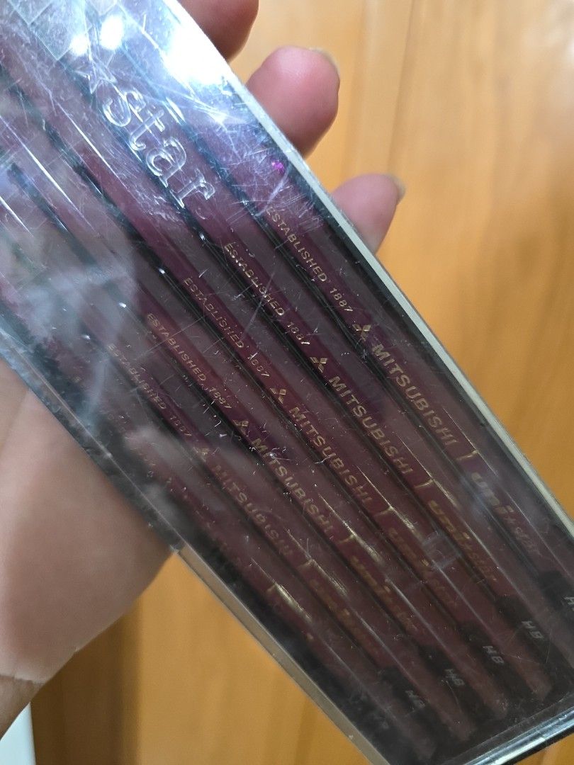 Mitsubishi Uni Star HB Pencils Set (Category: Craft Supplies & Tools) located in Bacoor. Submitted by tataandkai (Listing ID 1463300355, Image 3). Description: - Set of Mitsubishi Uni Star HB pencils - Comes in a clear plastic case - Original price tag shows ¥480 - Ideal for drawing or writing.