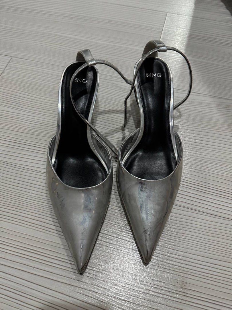 MNG Silver Slingback Heels with Ankle Strap (Category: Heels) located in Taguig. Submitted by anxmz (Listing ID 1463145359, Image 1). Description: - MNG silver slingback heels - Chic pointed toe design - Elegant thin ankle strap - Adds a dazzling metallic shine - Perfect for dressing up or down - Comfortable for extended wear - Worn once.