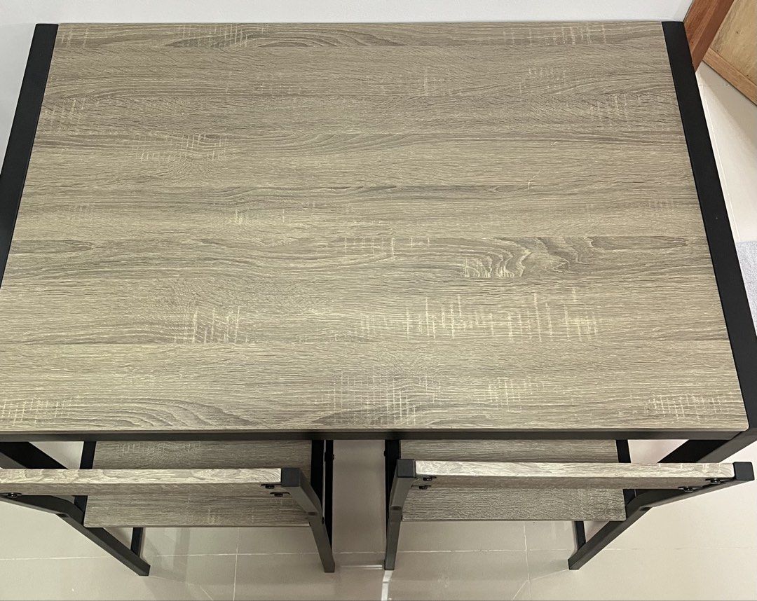 Modern 4-Seater Dining Table and Chairs Set (Category: Tables & Sets) located in Manila. Submitted by curated.clutter12 (Listing ID 1463282809, Image 3). Description: 🚨 RUSH SALE / MOVING OUT 🚨 Reason for Selling: Moving out and clearing spaces, needing funds ASAP! Letting go of this gorgeous, super practical 4-Seater Space-Saving Dining Set! Very modern and elegant Ash Wood/Gray tone with minimalist industrial black iron framing. Super perfect