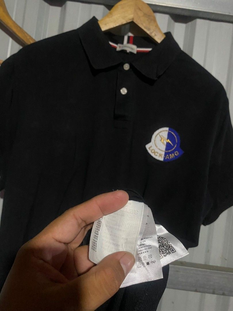 Moncler Black Polo Shirt with Patch (Category: Tshirts & Polo Shirts ) located in Bacolod City. Submitted by carlo1019 (Listing ID 1463324652, Image 3). Description: - Classic black Moncler polo shirt - Features iconic Moncler logo patch on chest - Comfortable fabric for all-day wear - Versatile for casual or slightly dressed-up occasions - Traditional polo collar with button closure - Refer to label for care instructions.