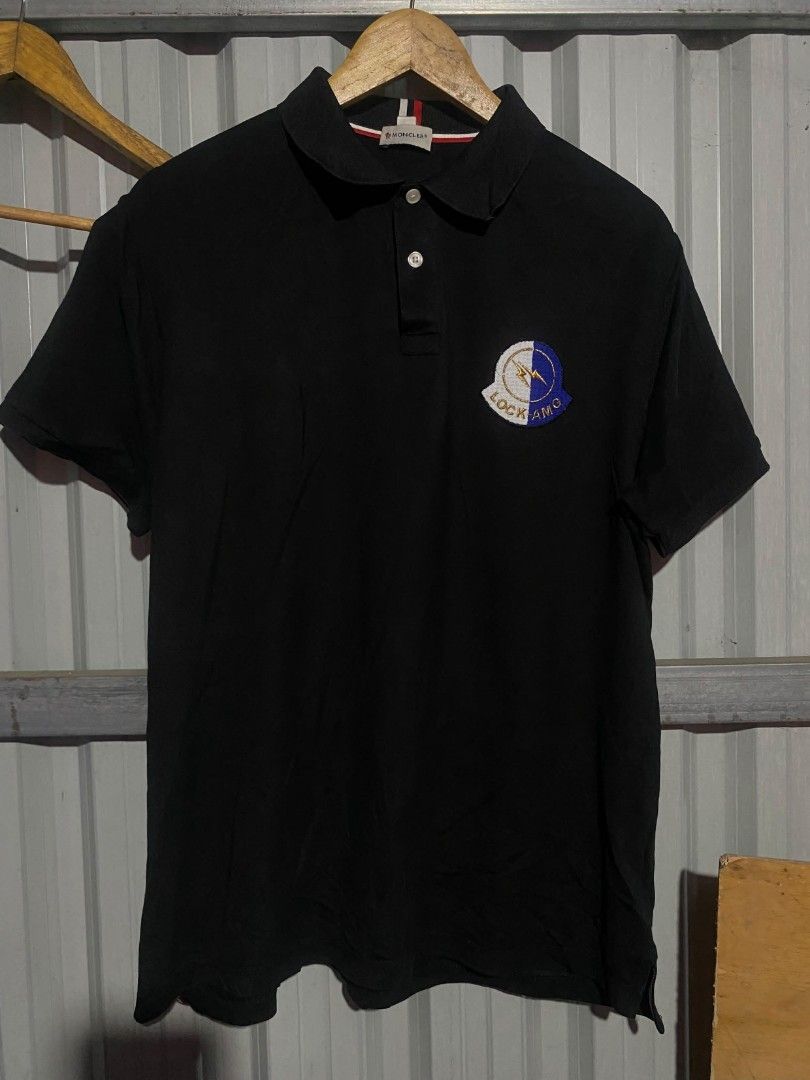 Moncler Black Polo Shirt with Patch (Category: Tshirts & Polo Shirts ) located in Bacolod City. Submitted by carlo1019 (Listing ID 1463324652, Image 1). Description: - Classic black Moncler polo shirt - Features iconic Moncler logo patch on chest - Comfortable fabric for all-day wear - Versatile for casual or slightly dressed-up occasions - Traditional polo collar with button closure - Refer to label for care instructions.