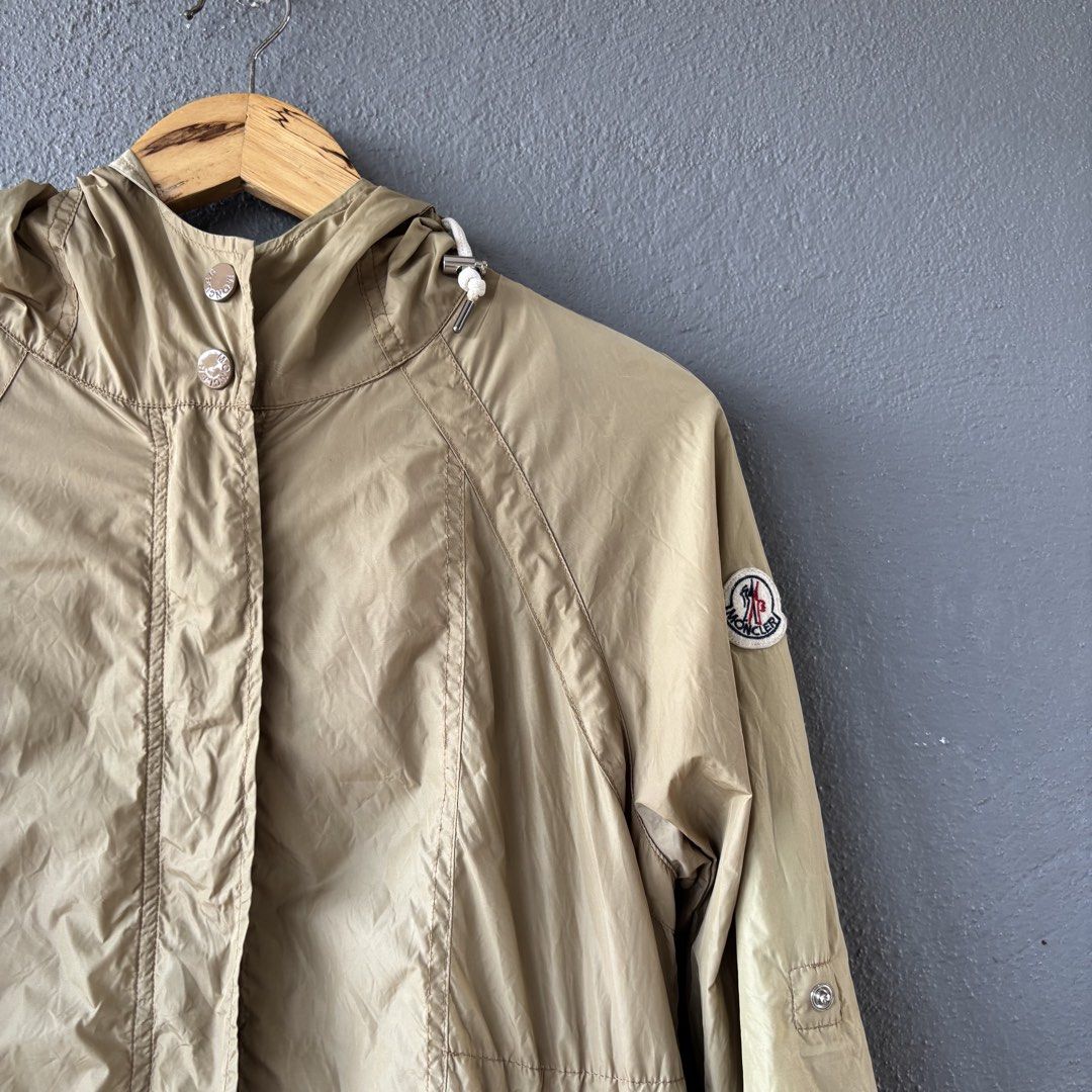 Moncler parka jacket (Category: Coats, Jackets and Outerwear) located in San Fernando. Submitted by diff.thr1ft (Listing ID 1463168709, Image 2). Description: - Brand: Moncler - Type: Parka Jacket - Color: Khaki - Features: Hood, zippered pockets, iconic logo patch, branded snaps - Material: Lightweight, durable - Condition: Excellent (as pictured) - Meetup Location: San Fernando, Pampanga.