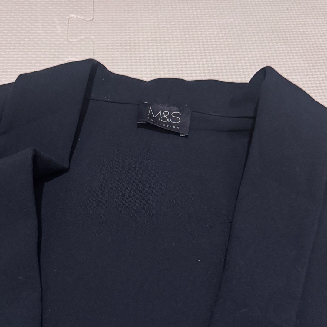M&S Collection Navy Blue Open Front Blazer (Category: Coats, Jackets and Outerwear) located in Marikina City. Submitted by prelovedsms (Listing ID 1463148703, Image 2). Description: - Navy blue blazer from M&S Collection - Open front style, oversized - Three-quarter sleeves - Ideal for layering over tops or dresses - Versatile for smart casual or work outfits - Measurements: Shoulder to shoulder approx. 16 inches, sleeve length approx. 18 inches.