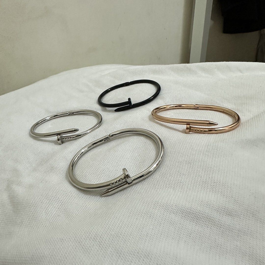 Nail Bangle Bracelets - Silver, Rose Gold, Black (Category: Bracelets) located in Bulacan. Submitted by enne_123 (Listing ID 1463238739, Image 3). Description: - ₱150 each - Available in Silver, Rose Gold, and Black. - Silver bangles feature an adjustable, open-cuff design. - Versatile for stacking with other bracelets or wearing as a statement piece..