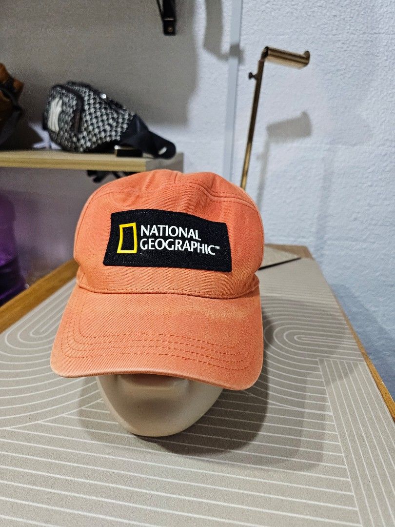 National Geographic panel cap (Category: Caps & Hats) located in Baguio. Submitted by kayeonlineshop (Listing ID 1463182266, Image 1). Description: -orange National Geographic panel cap featuring a prominent black and yellow brand patch on the front. Ask a follow-up.