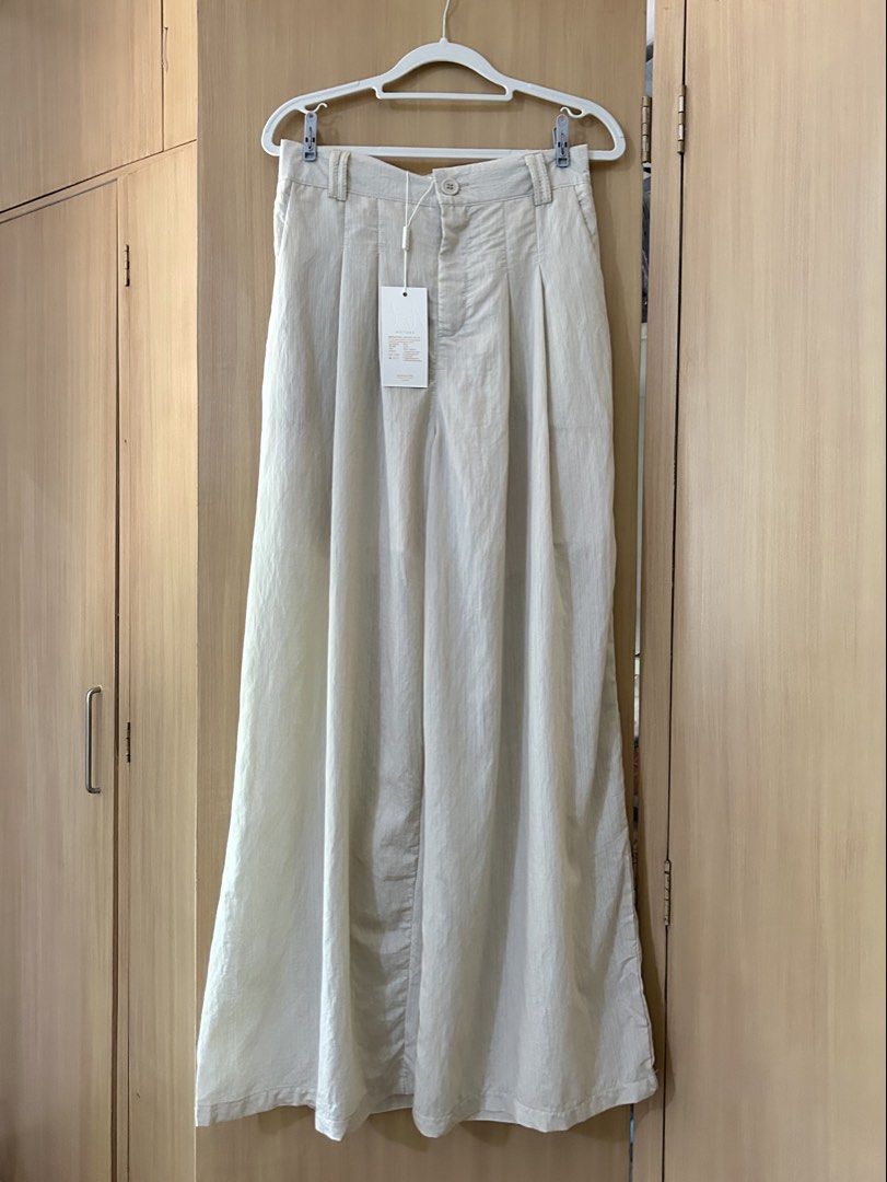 NATURE Ribbon Pants Freesize Beige (Category: Other Bottoms) located in Baguio. Submitted by tresmariascloset13 (Listing ID 1463174903, Image 1). Description: - Brand: NATURE - Color: Beige - Size: Freesize - Style: Ribbon pant, wide leg - Features: Textured fabric, elastic waistband at back - Condition: Brand new with tags attached .