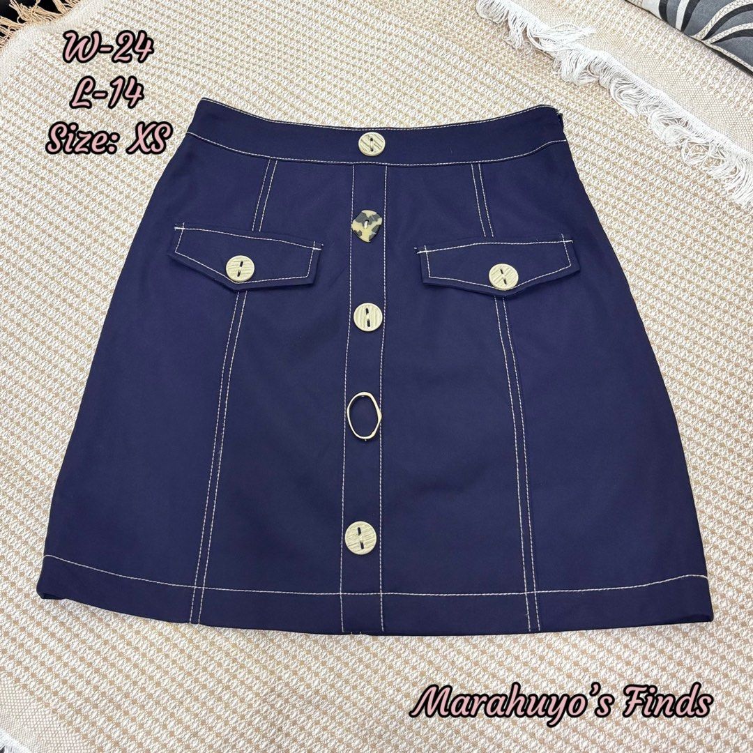 Navy Blue Button-Front A-Line Skirt with Contrast Stitching (Category: Skirts) located in Mabalacat. Submitted by marahuyos.finds (Listing ID 1463231234, Image 1). Description: - Cute navy blue skirt - Features contrast stitching all over - Button front closure - Two front pockets with button details - Belt loops on waistband - Versatile styling: casual or dressed up - Size: XS.